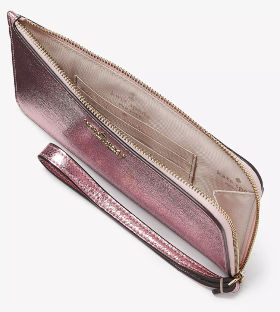 An overhead view at an angle showing the fabric lining and the card slot inside the wristlet