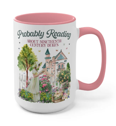 A mug with a pink interior and handle that reads Probably Reading about nineteenth century dukes
