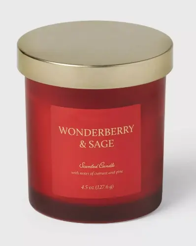 Wonderberry and Sage Scented candle with a red frosted glass container and a gold lid
