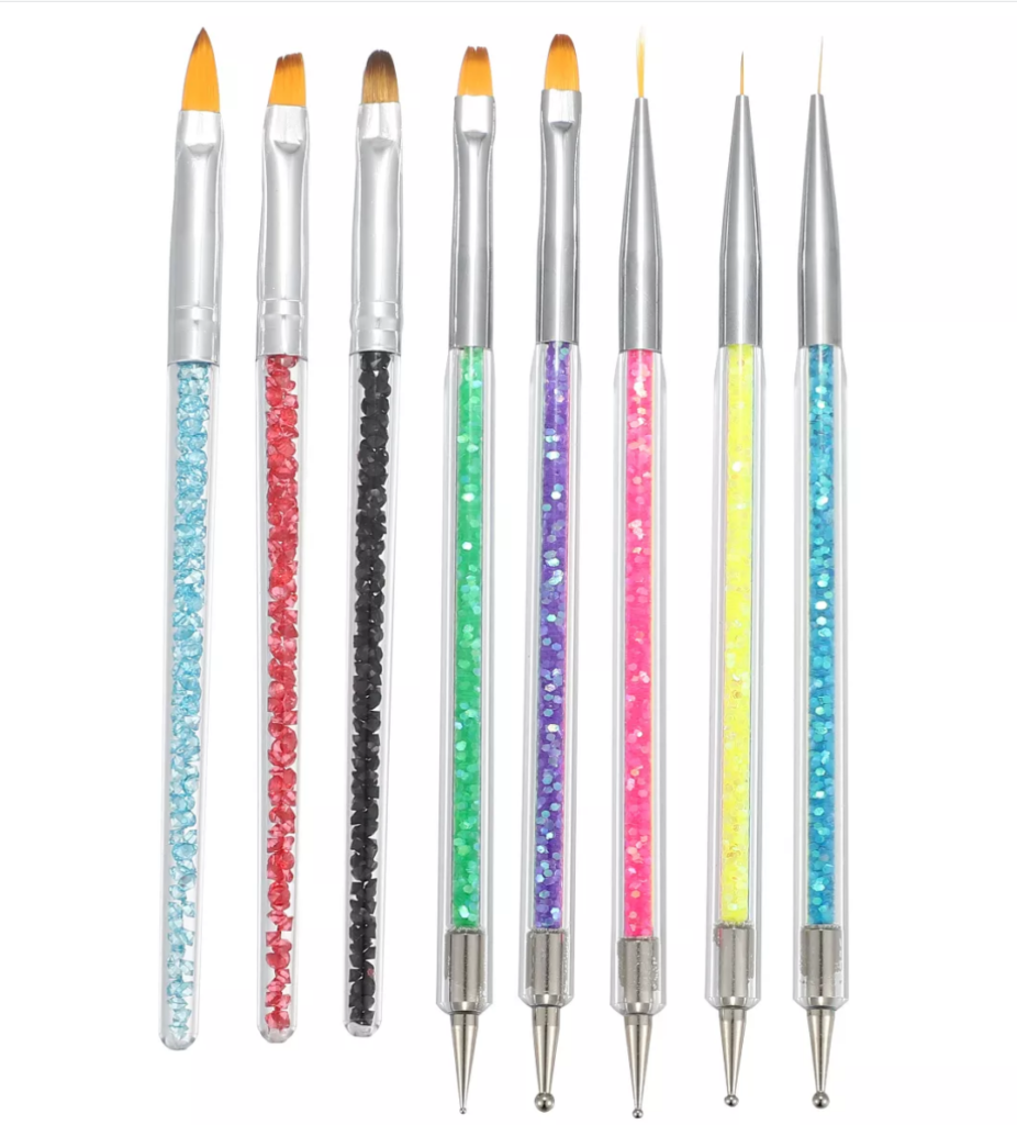 A set of nail brushes and dotting tools with rainbow handles.
