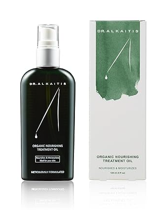 A green plastic bottle with a pump top alongside a green and white box. the box and the bottle have a stylized A logo without the cross bar of the A, and the words dr alkaitis organic nourishing treatment oil 