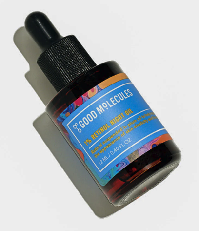 A dark glass bottle with a stopper lid, and a blue label that says good molecules, night oil retinol