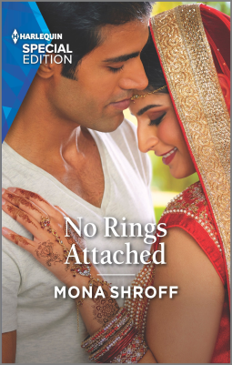 No Rings Attached by Mona Shroff. A photograph cover. A South Asian man and woman are standing close. He is wearing a v-neck white shirt. She is wearing a red and gold saree. A sheer red veil covers her hair. Her hand, which is decorated with henna and red and pearl bracelets, rests on his chest. Both figures are softly smiling.