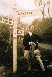 Sepia toned picture of Moss in men's jackets and trousers, with cropped hair