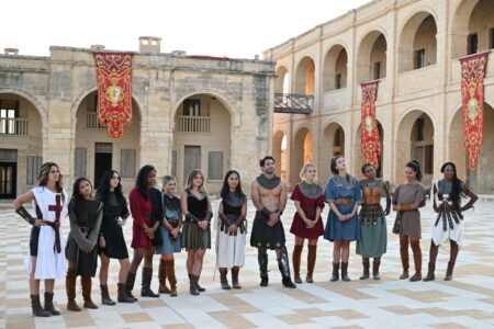 The group stands in the center of Fort Manoel wearing medieval warrior garb