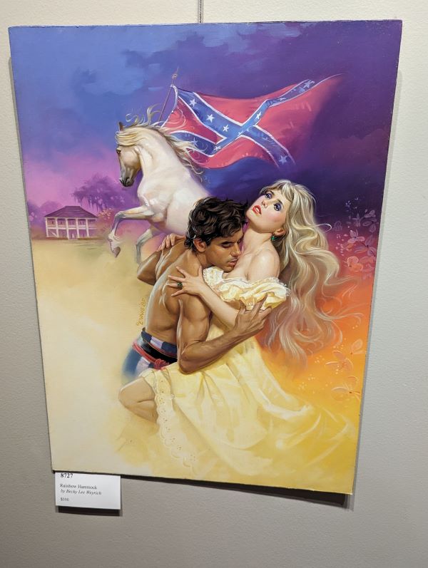 A white blonde woman with a rather nauseated expression is having her sternum nuzzzled by a guy in no shirt and blue and white striped pants and above them is a MASSIVE confederate flag