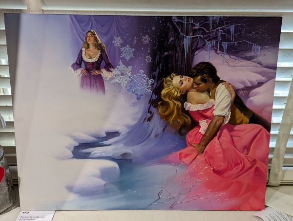 The cover art for Passion's Sweet Revenge featuring a brown haired white woman in a purple gown with her hands on her hips looking frustrated and the main couple are in a snowbank by a river with giant snowflakes falling and the blonde heroine is wearing a coral gown (in the RIVER GIRL get OUT you'll get hypothermia) whiel being embraced by a man with dark hair and a white shirt and waistcoat