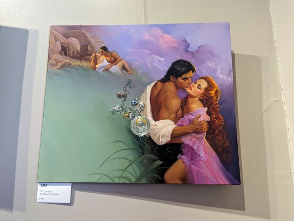 A woman in a purple gown with long red hair and a guy with his shirt half off, with a charm bracelet floating in the air behind them and in the top left corner is another image of the two laying down on some rocks ow to go to boentown