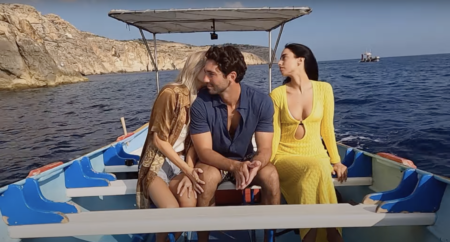 Joey sits in between Sydney and Maria on a boat