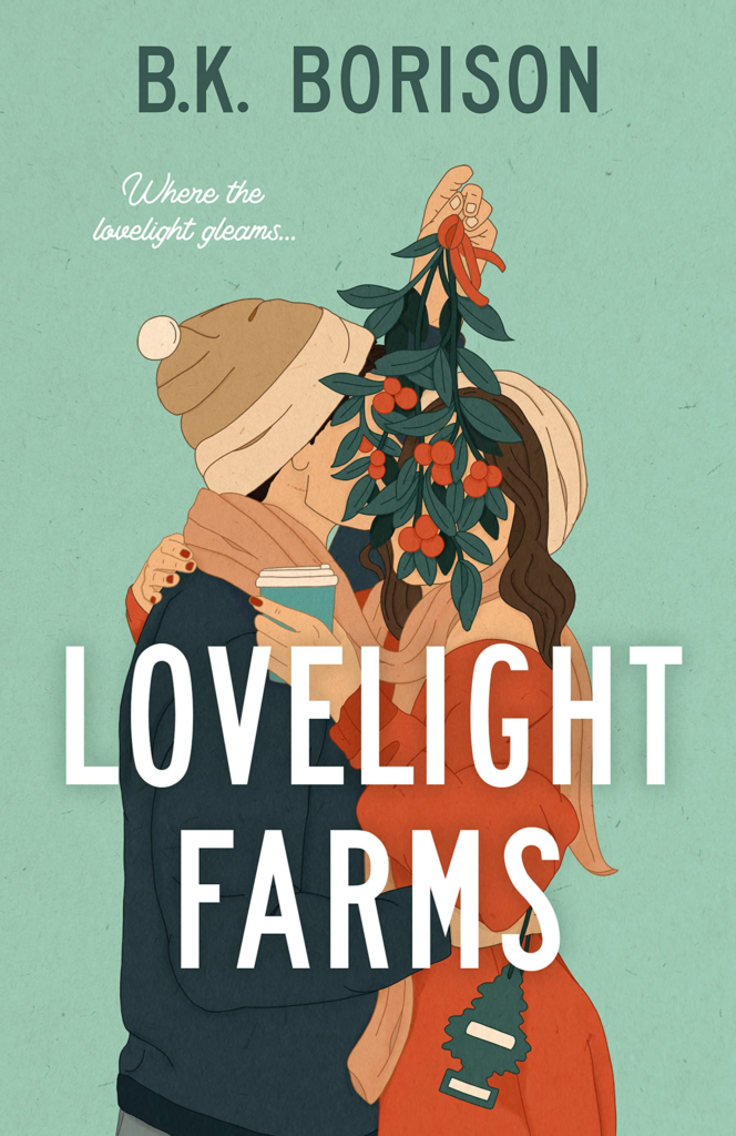Lovelight Farms by B.K. Borison. A man and woman are standing closely, wrapped in each other's arms. They are wearing winter clothing - beanies, scarves, jackets. The woman holds a coffee cup in her free hand. The man dangles a large sprig of mistletoe in front of their faces, obscuring them.