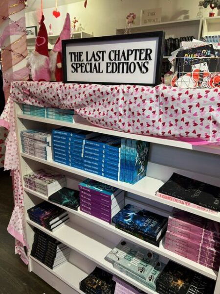 A sign over a shelf of books says Last Chapter Special Editions.