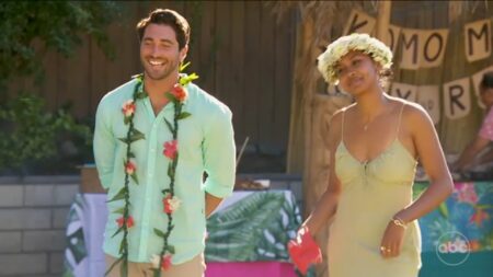 Rachel and Joey stand next to each other smiling. 