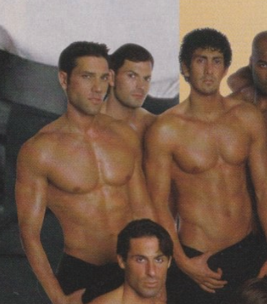 A close up of four of the dudes, with one guy hiding nearly entirely behind two other dudes 