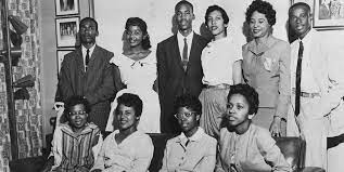 The Little Rock Nine and Daisy Betts posing for a group photo