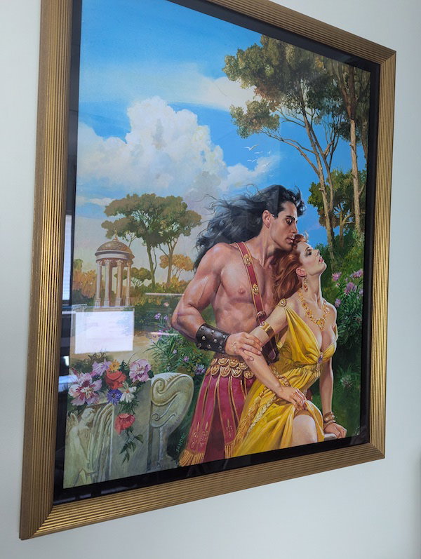 A Sandro painting of The Lion and the Lark by Doreen something, and it's de salvo in a hot pink gladiator toga with a woman in a very busty yellow gown
