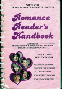 The Romance Readers Handbook, a pink cover spiral bound with pictures of five authors including Laura Kinsale and Heather Graham 
