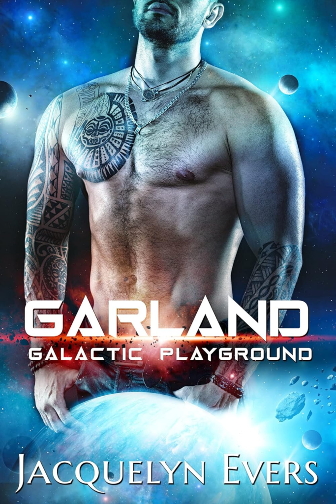 Garland Galactic Playground by Jacquelyn Evers. The background is of a space scene. There's a shirtless man with half of his face cut off by the top of the cover. His hands are in the pockets of his jeans and he has a tribal pec tattoo. His head is slightly tipped back in boredom