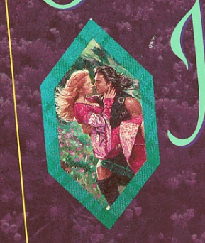 A close up of the cover inset with a woman in a pink gown and blonde hair being blown back being lifted in the arms of a guy with long windy black hair blowing in the opposite direction