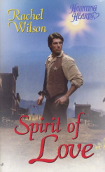 A white man in a vest and star stands in a desert landscape with a hanging scaffold and some wagon wheels behind him but he has no legs below the knees. there's also a gun pointed at his dick.