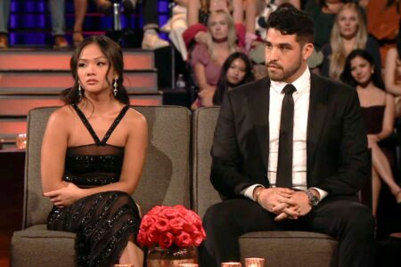 Jenn and Devin sit next to each other.