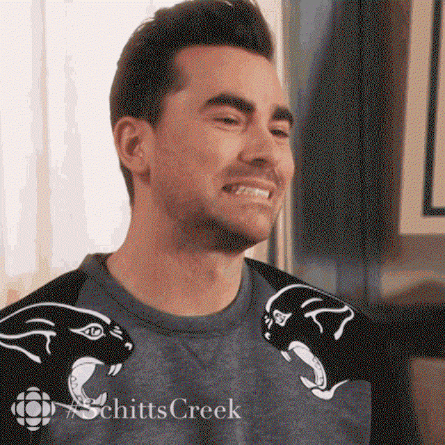 David from Schitt's Creek nods and grimaces