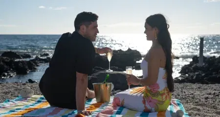 Devin and Jenn have a beach picnic.