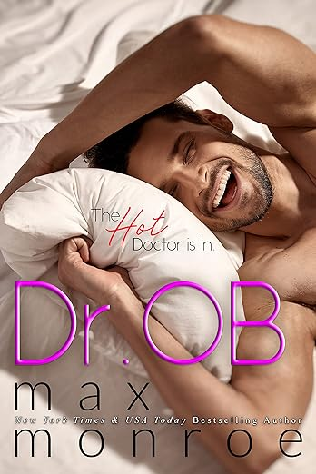 Dr. Ob by Max Monroe. A man is rolling around in a very white bed and laughing. The title is what gives us pause.