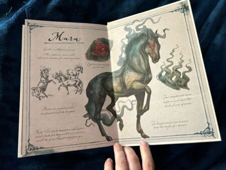 Illustrated endpapers that show a mythical demonic horse in what looks like watercolor