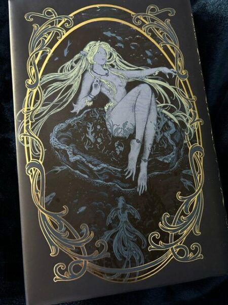 The back of the book is another art nouveau illustration with a fey or nymph like creature on it