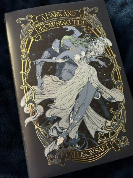 The cover for a Dark and Drowning Tide has an art nouveau vibe with a woman and man sort of dancing or floating together. They are both rendered in grey and she is wearing a white dress, while the frame around them is gold