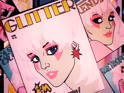 Animation from the opening of Jem and the Holograms where she winks from the cover of a magazine. Jem has pink hair, bangs, and stars on her ears, with pink makeup like kiss over her eyes 