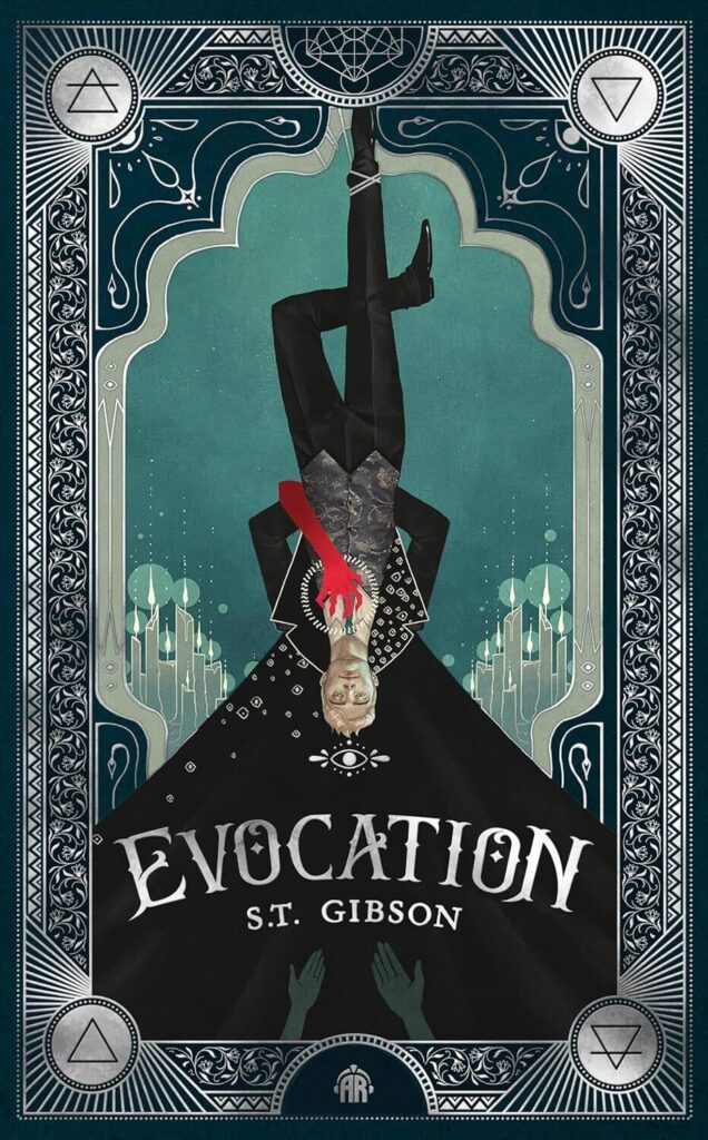Evocation by S.T. Gibson. The cover is designed like the Hanged Man tarot card with a man hanging upside down with his legs crossed. This has a muted teal background with silver border designs. The figure is dressed in black with his cape falling downward behind his head. Two gray arms are welcoming him at the bottom of the cover. A red arm is also snaking around his back to grasp at his chest.