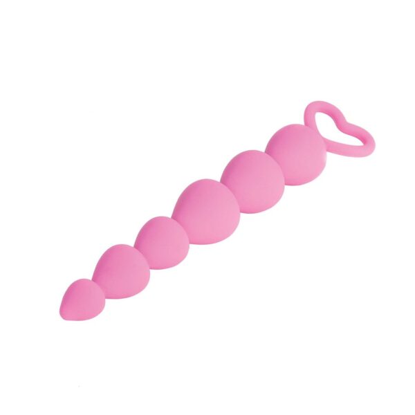 A pink sex toy made of silicone with a stack of hearts from tip to end, each heart getting a little bigger and wider, with a heart-shaped loop handle