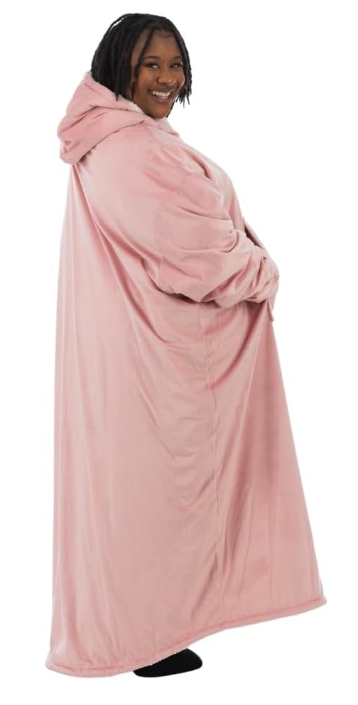 The same fleece and microfiber hoodie, only this one goes to the ankles. It's being worn by a Black woman with braids who is smiling at the camera and looks exceedingly cozy