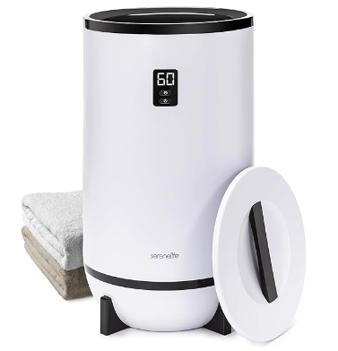 A white barrel shaped device with black accents and a digital dial on the front with a lid