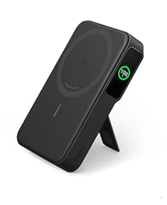 A black backup battery with a green digital display and a kickstand. There's a light grey circle on one side 