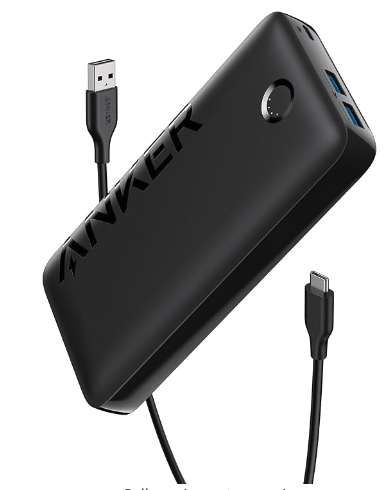 A black power bank with a small circle on one side that's a power button I suppose plus a USB C cord in the background