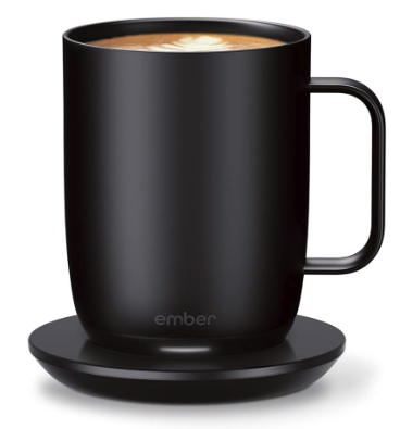 A 14oz black mug on a black coaster 