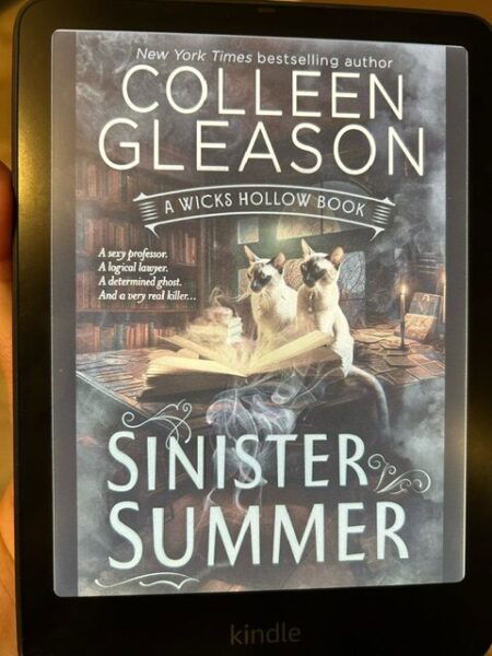 The blue and brown cover of Sinister Summer