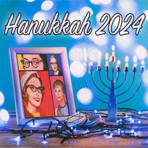 Hanukkah 2024 with a framed picture of the original ladies and a menorah with blue lights on the table 