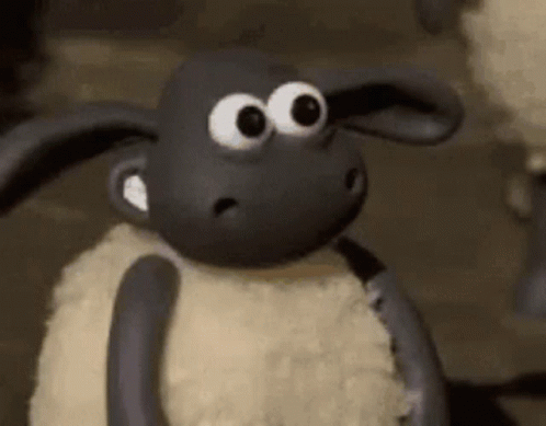 A black sheep in the gromit world gives a thumbs up with a big sile 