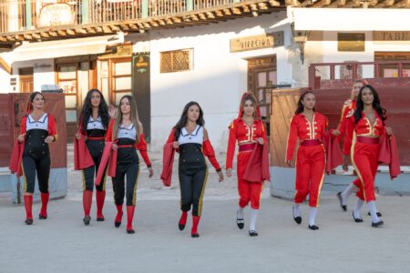 The women are dressed like matadoras