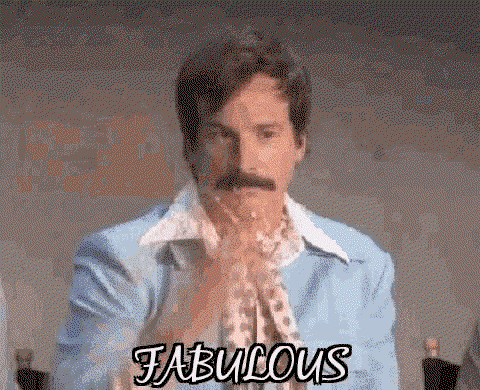 A guy throws glitter and the word fabulous is in front of him