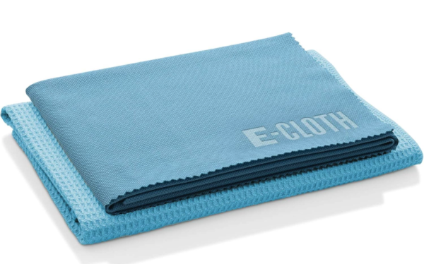 A stack of two blue microfiber cloths, in two different textures 