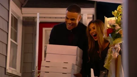 Grant and Juliana show up with a stack of pizzas