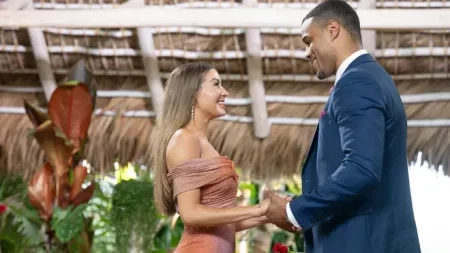 Grant and Juliana hold hands
