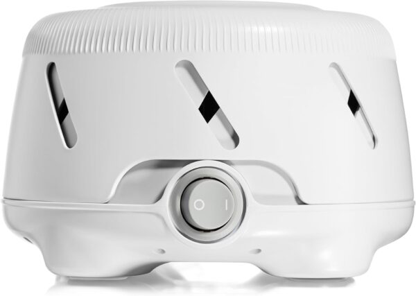 A white round white noise machine with a grey knob on the front. 