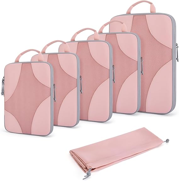 a set of five pink packing cubes with a folded pink shoe bag in front 
