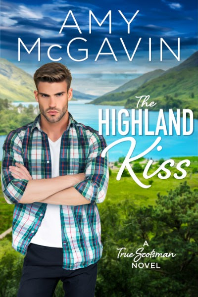 The Highland Kiss by Amy McGavin. The background is green hills and a beautiful blue lagoon. There's a man in a blue plaid shirt with his arms crossed looking really mad.