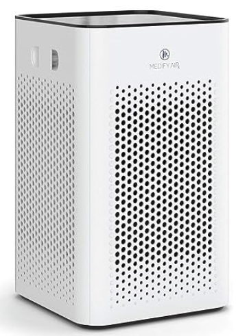 Medify MA-25 air purifier - a tall rectangle in white with perforated sides and a black edge at hte top and bottom 